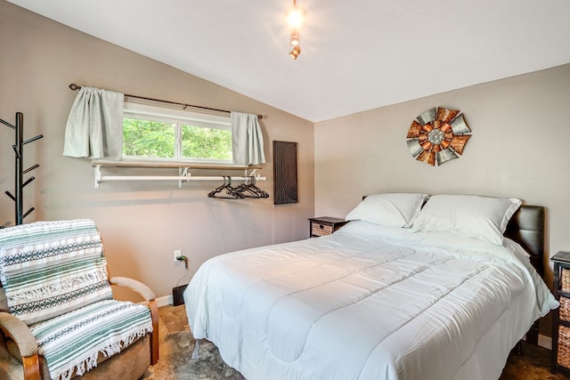 bedroom featuring carpet floors and lofted ceiling