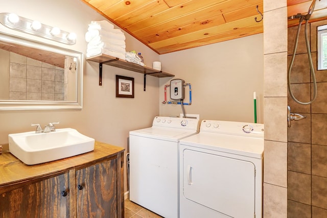 laundry area featuring independent washer and dryer, wooden ceiling, sink, and light tile patterned floors