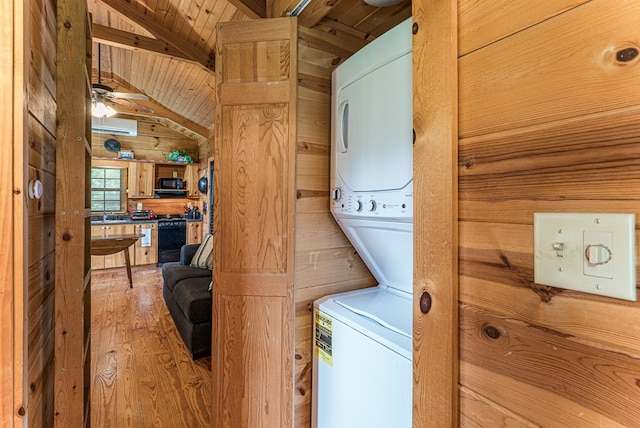 93 Lazy Bear Trl, Andrews, NC 28901 - washroom featuring stacked washer and clothes dryer, wooden ceiling, wooden walls, light wood finished floors, and ceiling fan