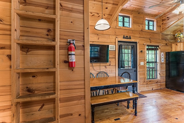 93 Lazy Bear Trl, Andrews, NC 28901 - dining room featuring wooden ceiling, wood walls, light wood finished floors, a ceiling fan, and high vaulted ceiling