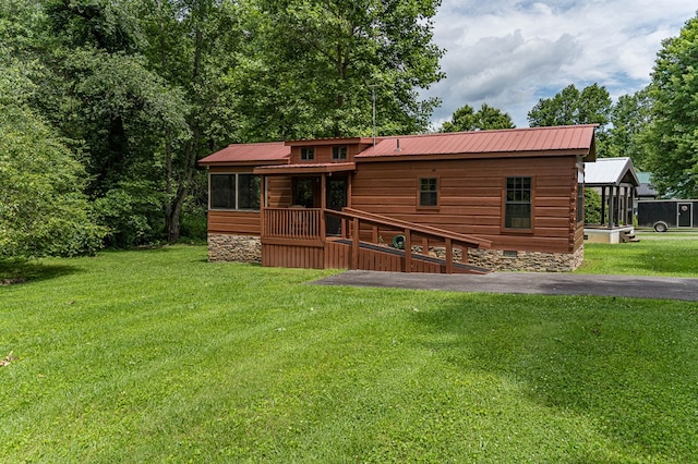 93 Lazy Bear Trl, Andrews, NC 28901 - back of property with metal roof, a yard, and a sunroom