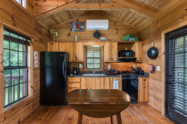 93 Lazy Bear Trl, Andrews, NC 28901 - kitchen featuring black appliances, wooden walls, dark countertops, light wood-type flooring, and a sink