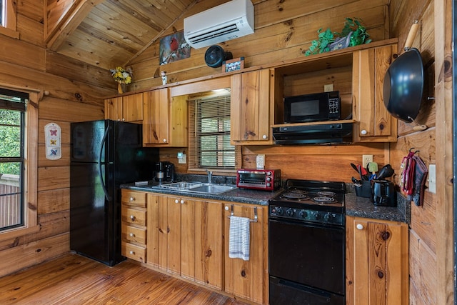93 Lazy Bear Trl, Andrews, NC 28901 - kitchen with black appliances, a wall mounted air conditioner, a sink, dark countertops, and lofted ceiling