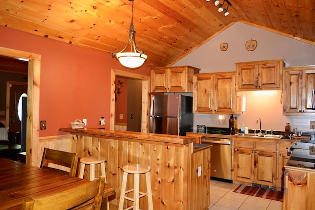 115 Black Oak Ridge Rd, Blue Ridge, GA 30513 - kitchen with appliances with stainless steel finishes, a sink, a wainscoted wall, a kitchen bar, and wooden ceiling