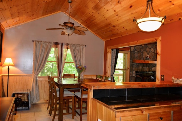 115 Black Oak Ridge Rd, Blue Ridge, GA 30513 - dining space featuring vaulted ceiling, wooden ceiling, healthy amount of natural light, light tile patterned floors, and ceiling fan