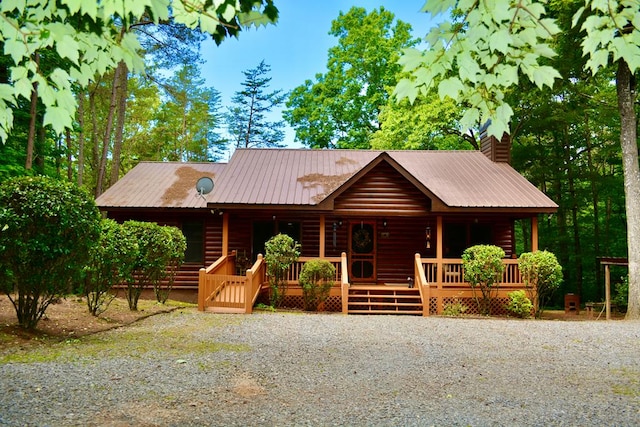 115 Black Oak Ridge Rd, Blue Ridge, GA 30513 - view of front of home with a chimney, covered porch, metal roof, and log veneer siding