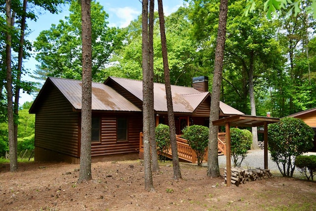 115 Black Oak Ridge Rd, Blue Ridge, GA 30513 - view of front of house with log veneer siding, a chimney, and metal roof