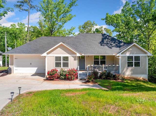 single story home with covered porch, board and batten siding, a front lawn, concrete driveway, and an attached garage