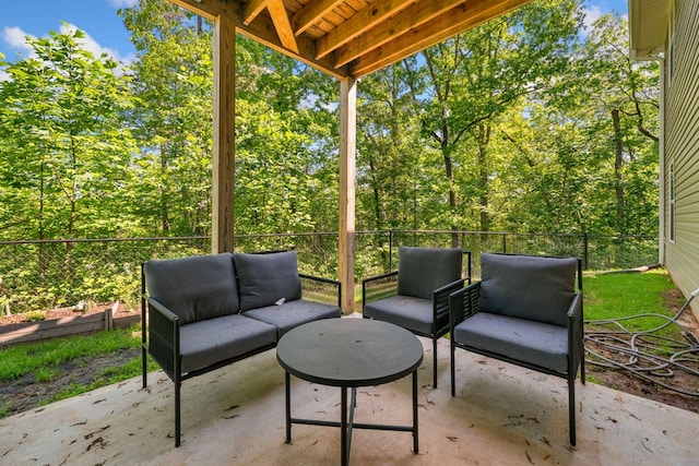 view of patio with outdoor lounge area and fence