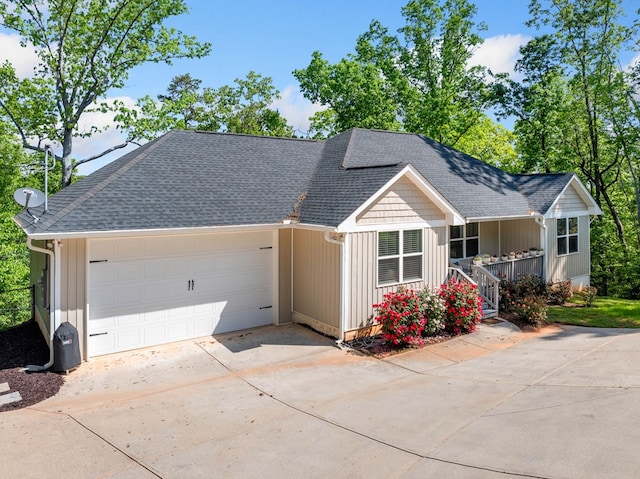 ranch-style home with concrete driveway, an attached garage, a shingled roof, and a porch