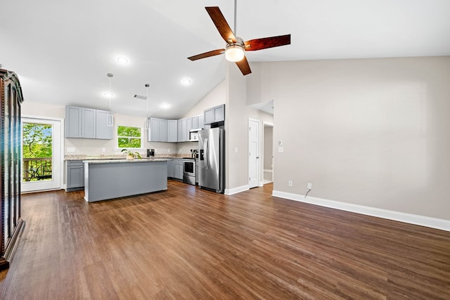 unfurnished living room featuring baseboards, a ceiling fan, dark wood finished floors, and visible vents