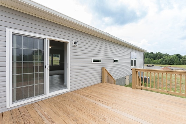 wooden deck with central AC unit