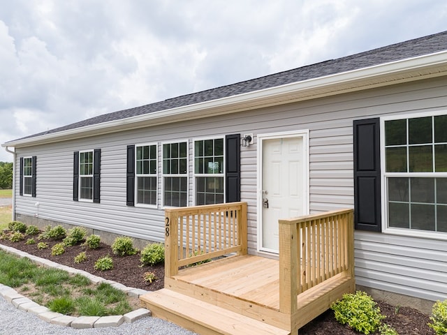 doorway to property with a deck