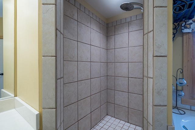 full bath with tiled shower