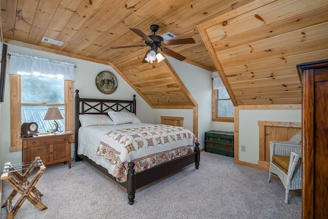 bedroom with wood ceiling, visible vents, vaulted ceiling, and light colored carpet