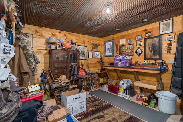 misc room with wooden walls and a workshop area