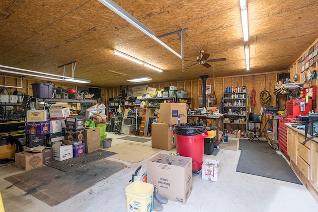 garage with ceiling fan and a workshop area