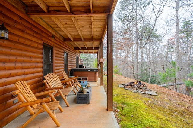 view of patio / terrace with a hot tub