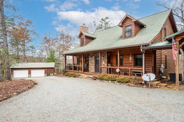 log cabin featuring roof with shingles, a detached garage, a chimney, covered porch, and an outdoor structure