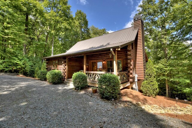 view of property exterior featuring covered porch