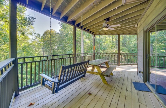 wooden deck featuring ceiling fan