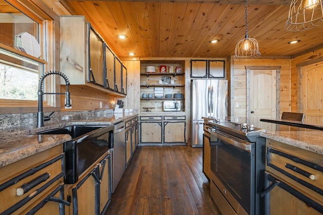 kitchen with hanging light fixtures, stainless steel appliances, wood walls, wood ceiling, and dark hardwood / wood-style floors