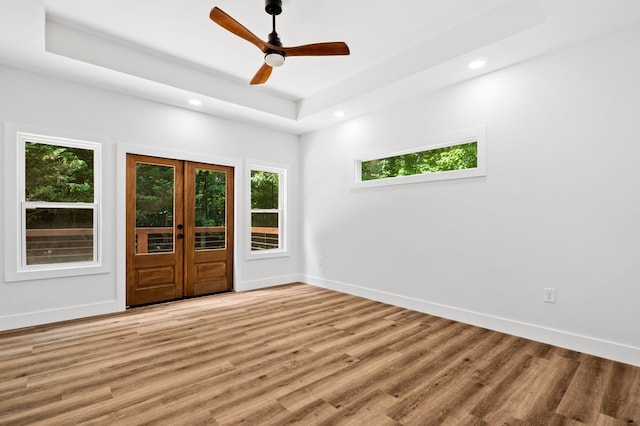 109 Lakeview Ct, Ellijay, GA 30540 - unfurnished room featuring a tray ceiling, plenty of natural light, light wood-style floors, recessed lighting, and ceiling fan