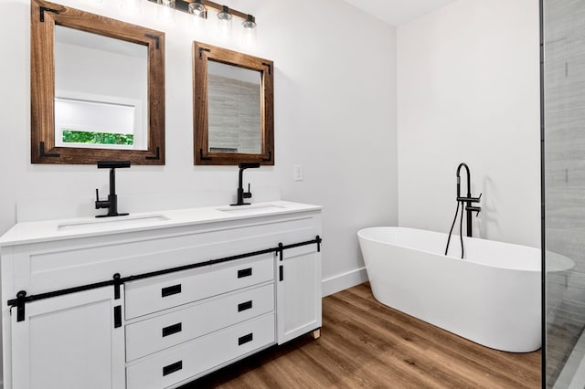 109 Lakeview Ct, Ellijay, GA 30540 - full bathroom with double vanity, a soaking tub, and wood finished floors