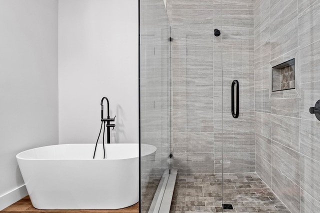 109 Lakeview Ct, Ellijay, GA 30540 - full bath with a freestanding tub, a shower stall, and a baseboard radiator