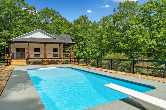109 Lakeview Ct, Ellijay, GA 30540 - view of swimming pool with a diving board and view of wooded area