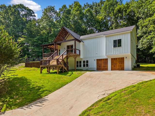 109 Lakeview Ct, Ellijay, GA 30540 - view of front of house with board and batten siding, stairs, an attached garage, concrete driveway, and roof with shingles