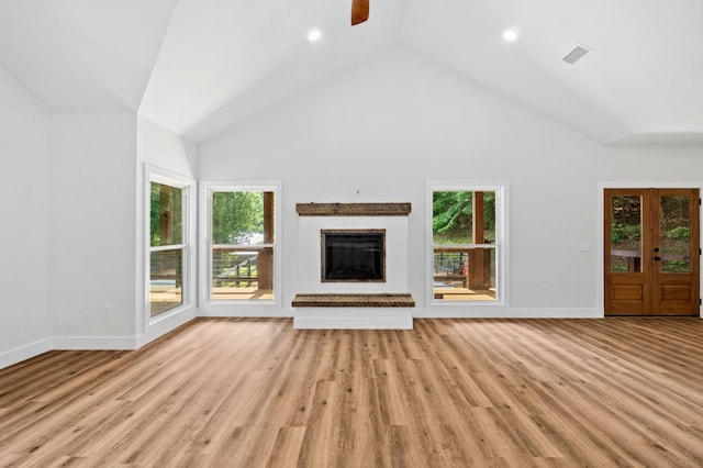 109 Lakeview Ct, Ellijay, GA 30540 - unfurnished living room featuring a ceiling fan, plenty of natural light, a brick fireplace, lofted ceiling, and light wood finished floors