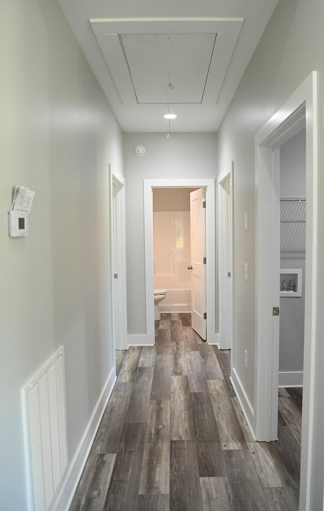 hall with dark hardwood / wood-style flooring