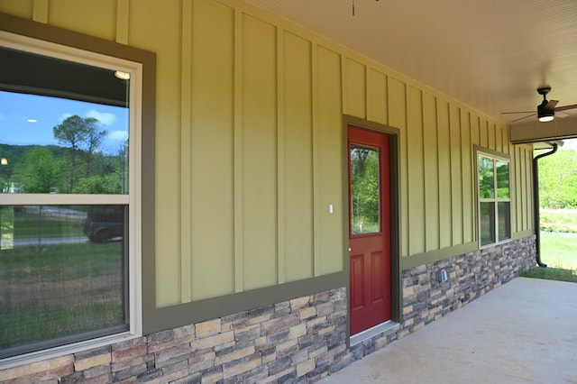 doorway to property featuring ceiling fan