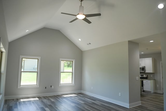 unfurnished room featuring high vaulted ceiling, dark wood-type flooring, and ceiling fan