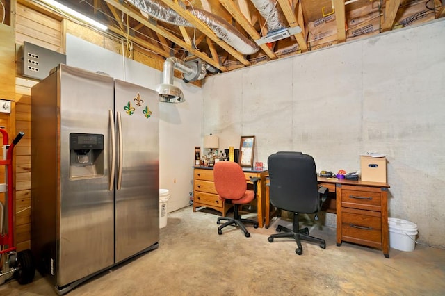 office area featuring unfinished concrete floors