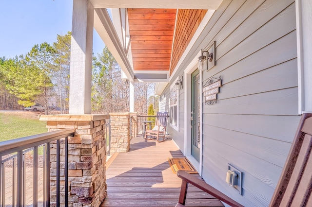 wooden deck featuring covered porch