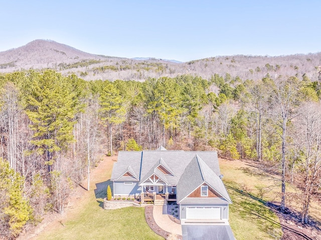 aerial view featuring a mountain view and a wooded view