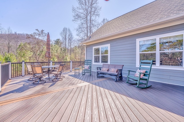 wooden deck with outdoor dining area