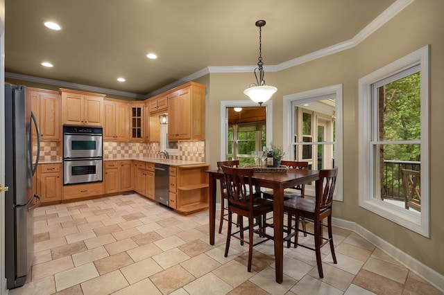 kitchen featuring tasteful backsplash, freestanding refrigerator, stainless steel double oven, dishwashing machine, and baseboards