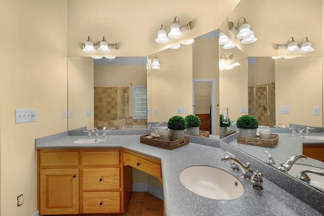 bathroom featuring a sink, a stall shower, and double vanity