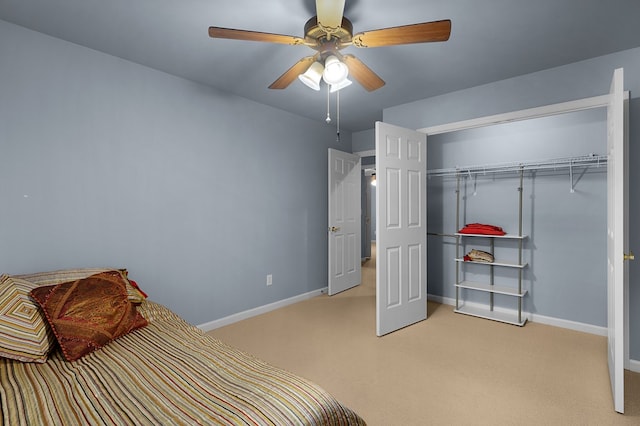 bedroom with ceiling fan, baseboards, and light carpet