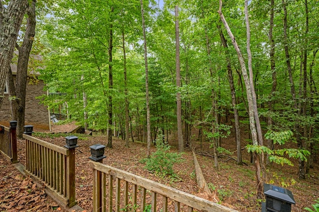 view of yard with a view of trees