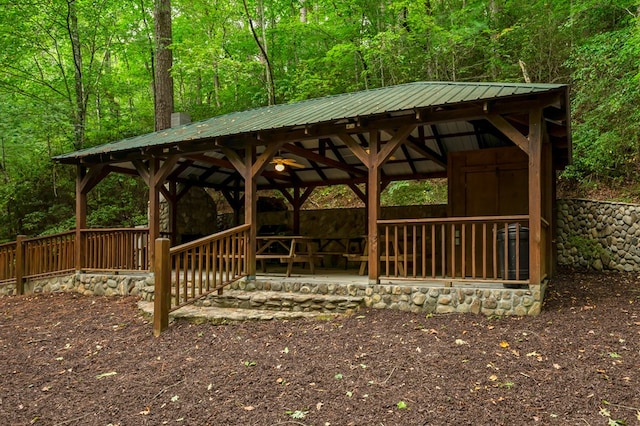 view of property's community featuring a gazebo and a view of trees