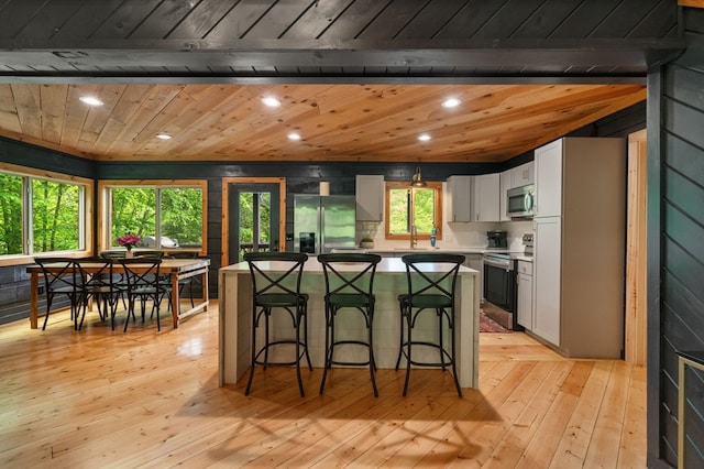 149 Happy Hollow Ln, Mineral Bluff, GA 30559 - kitchen featuring stainless steel appliances, a center island, a breakfast bar area, wood ceiling, and recessed lighting