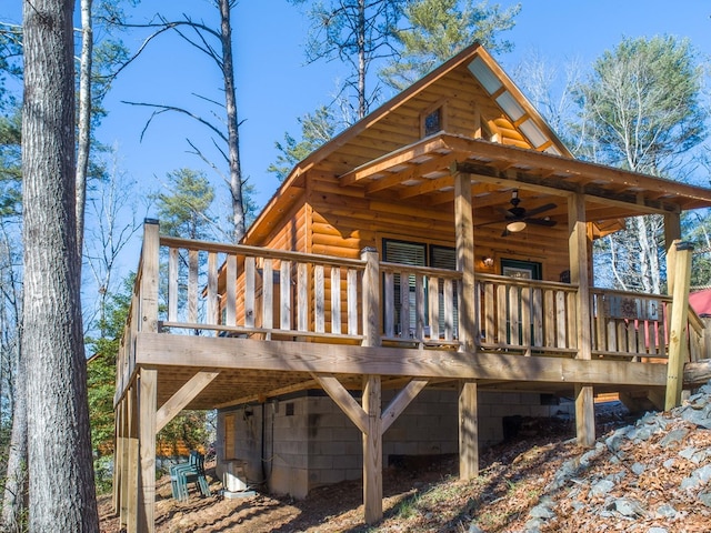 wooden terrace featuring ceiling fan