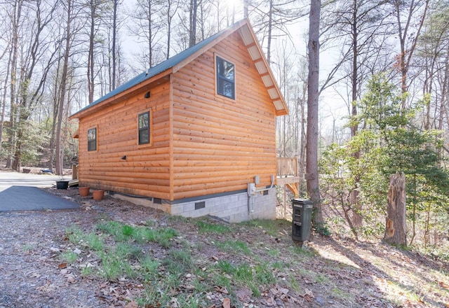 view of home's exterior with crawl space and central air condition unit