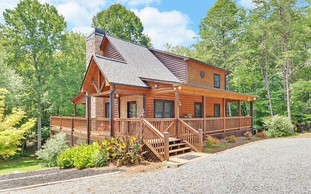 log-style house featuring a porch