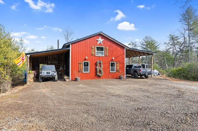 view of outbuilding with a carport