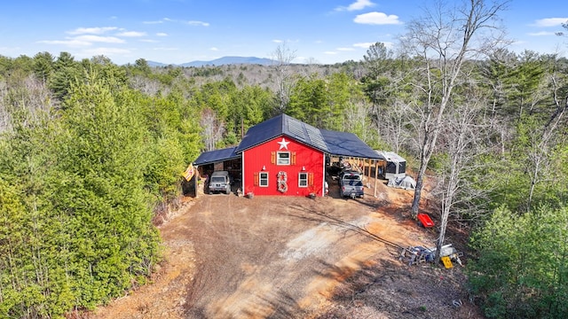 view of outbuilding with a carport